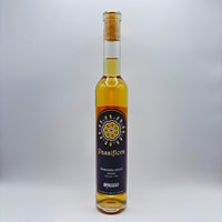 Botella estilizada de hidromiel dulce Passiflora con maracuyá, mostrando una etiqueta oscura con un diseño de mandala multicolor y el logo de Costa Rica Meadery sobre un fondo neutro.